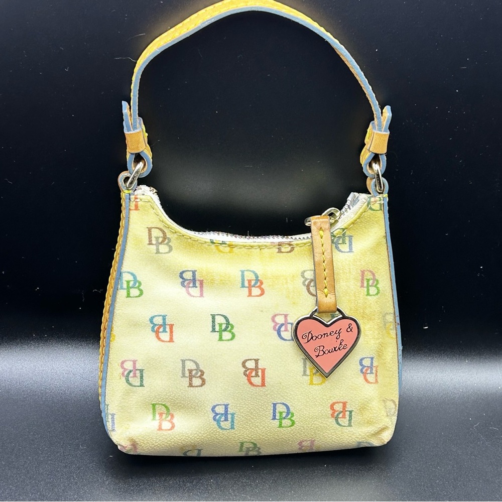 Dooney & Bourke Itsy Bitsy Ivory Multi-Color Monogram MIni Handbag.